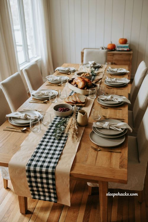 Black and white buffalo check butcher paper Thanksgiving table with dried wheat cotton and farmhouse decor 