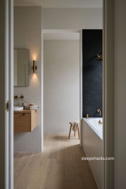 Black hex tile bathroom with white subway tile Scandinavian style