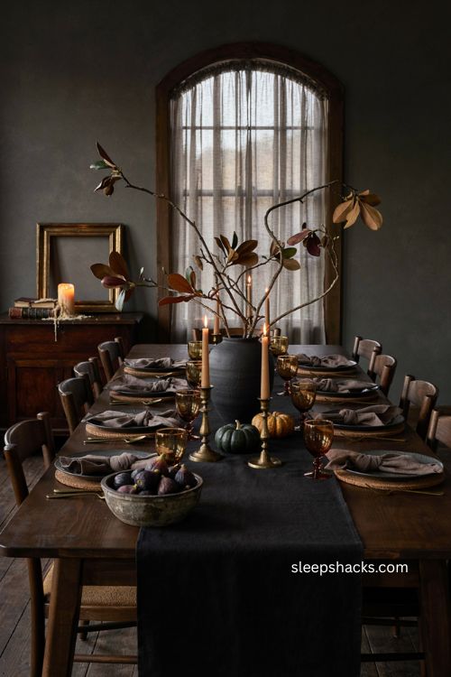Black vase Thanksgiving tablescape with fall branches candlelight dark runner and moody vintage decor 