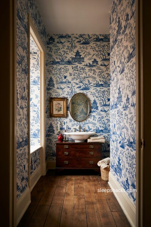Blue and white Chinoiserie bathroom with antique furniture vintage art and red accents 