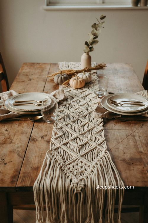 Boho thanksgiving table with cream macramé runner and natural woven décor