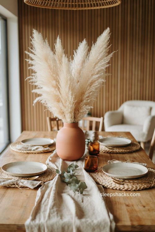 Boho thanksgiving table with mismatched vintage glassware and earthy décor
