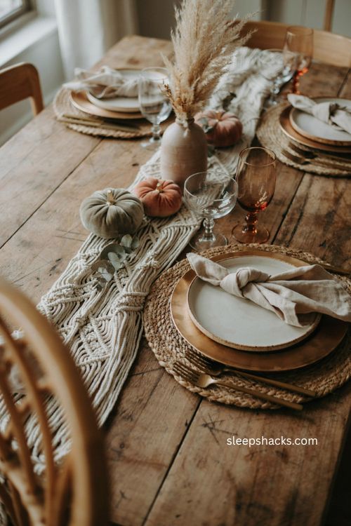 Boho thanksgiving table with woven rattan placemats and earthy layered décor