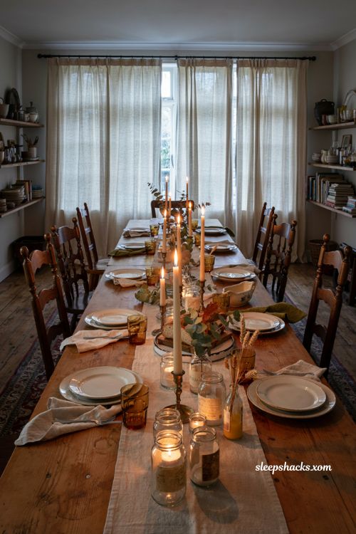 Candlelight Thanksgiving table with taper candles glass votives and jam jar tea lights 