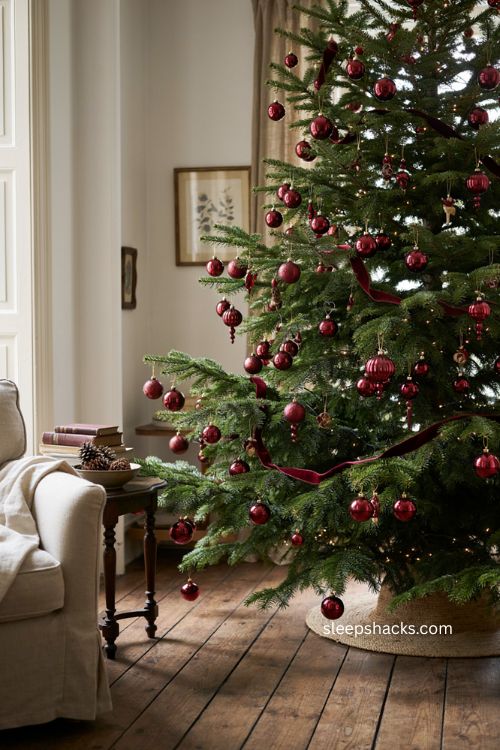 Cascading burgundy ornament garland Christmas tree with clustered baubles 