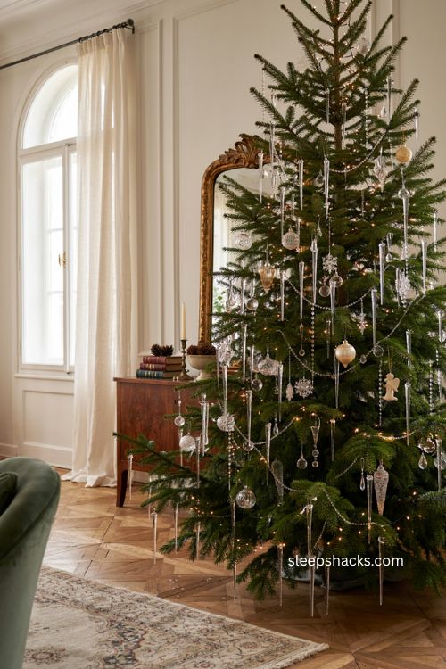 Cascading crystal icicle christmas tree with layered hanging ornaments sparkling warm white lights and winter elegance 