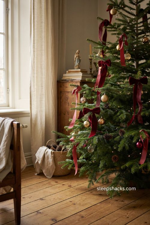 Cascading velvet ribbon bows with long tails on Christmas tree 