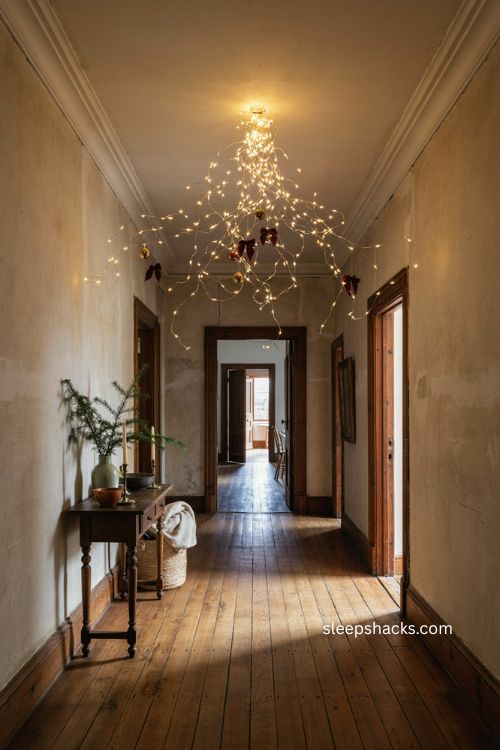 Chandelier style Christmas light cascade over a hallway intersection 