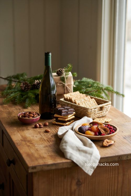 Christmas client gift with gourmet food wine artisan snacks and elegant holiday presentation 