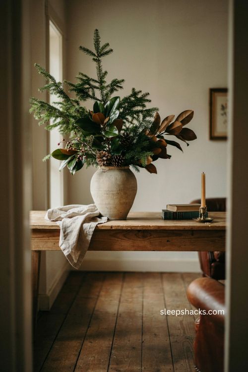 Christmas console table decor with one large greenery statement piece 