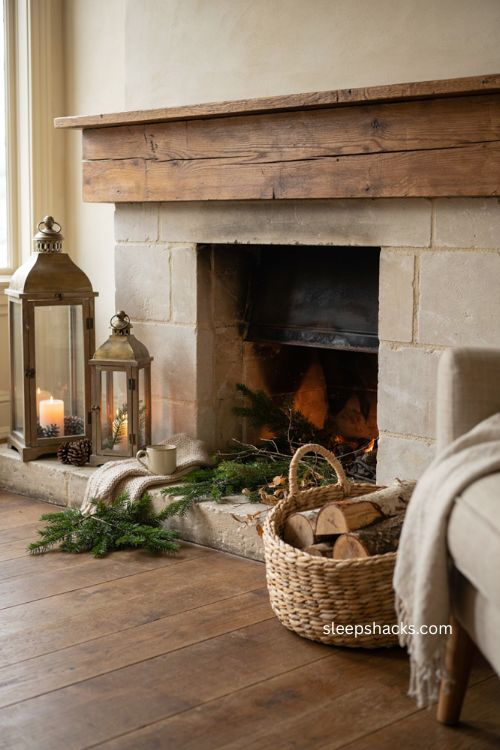 Christmas fireplace hearth with lanterns woven firewood basket and cozy decor