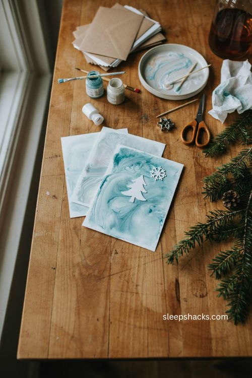 Christmas handmade foam marbling winter cards with icy blue white swirls snowflakes and paper trees 