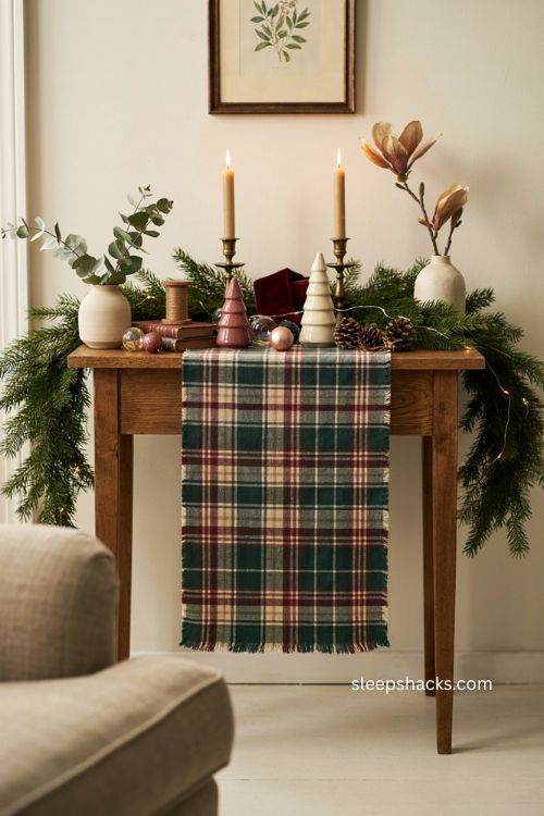 Christmas sofa table decor with plaid runner garland candles and cozy farmhouse style