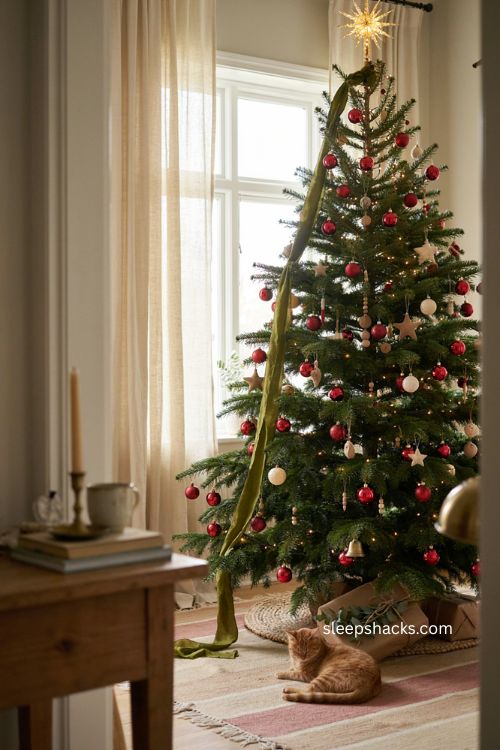 Christmas tree garland with cascading green felt ribbon and colorful ornaments 