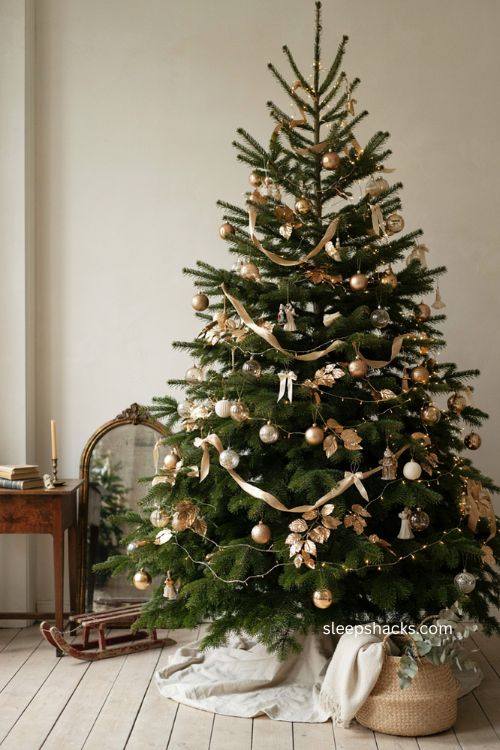 Christmas tree garland with flowing gold draping and elegant coordinated ornaments 