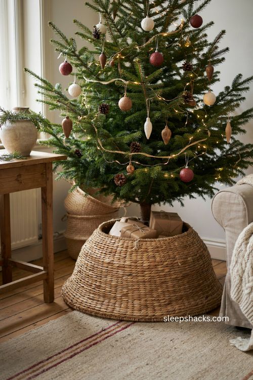 Christmas tree with upside down wicker basket collar and natural wood ornaments 