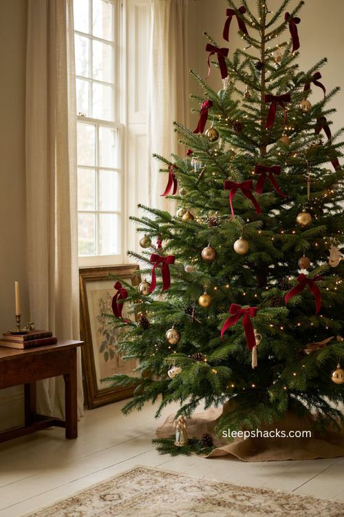 Classic red velvet bows Christmas tree with gold ornaments