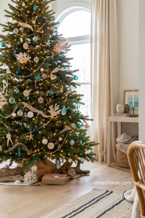 Coastal Christmas tree with faux coral driftwood and beach inspired ornaments 