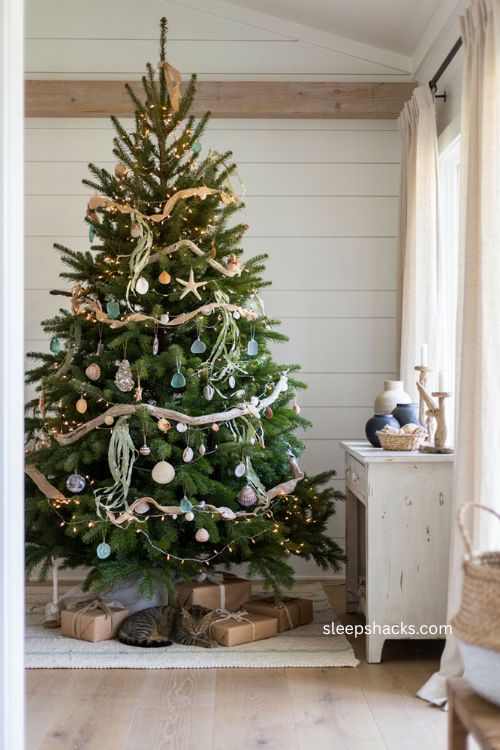 Coastal Christmas tree with shell seaweed and driftwood garland 