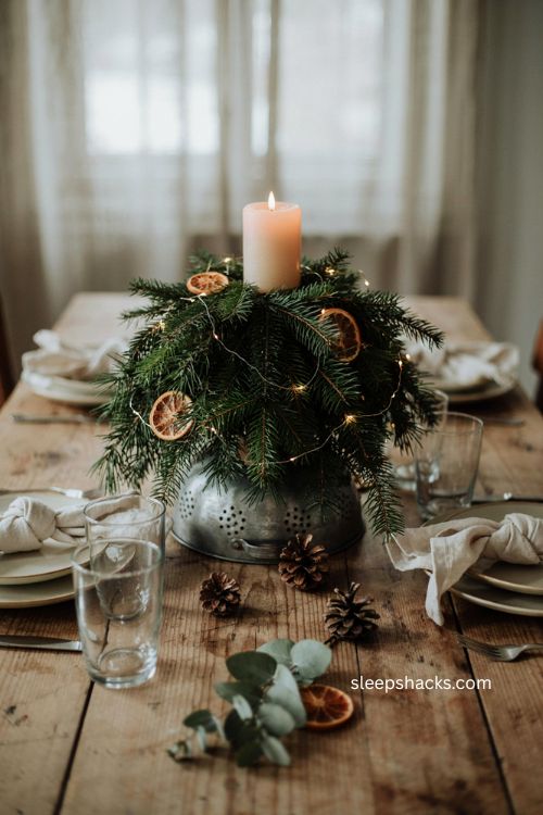 Colander greenery Christmas centerpiece with dried orange slices and lights 