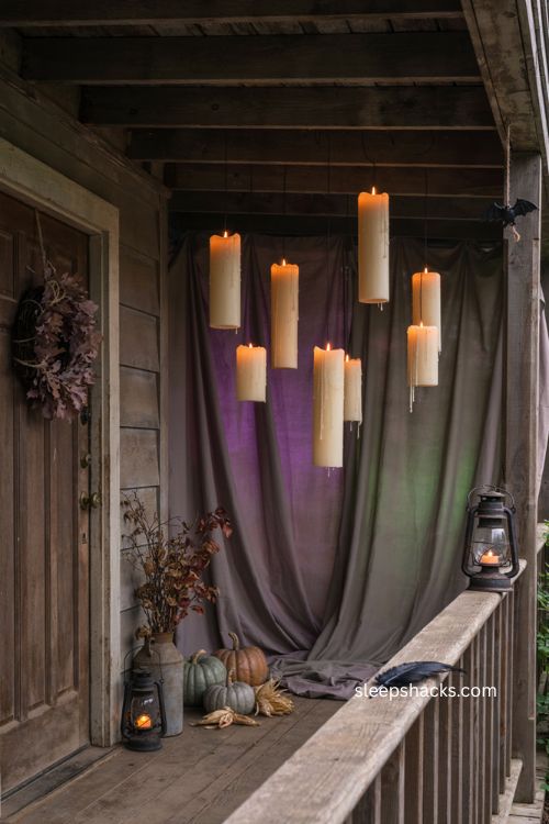 Color changing lights behind floating candles for dramatic Halloween porch decor 
