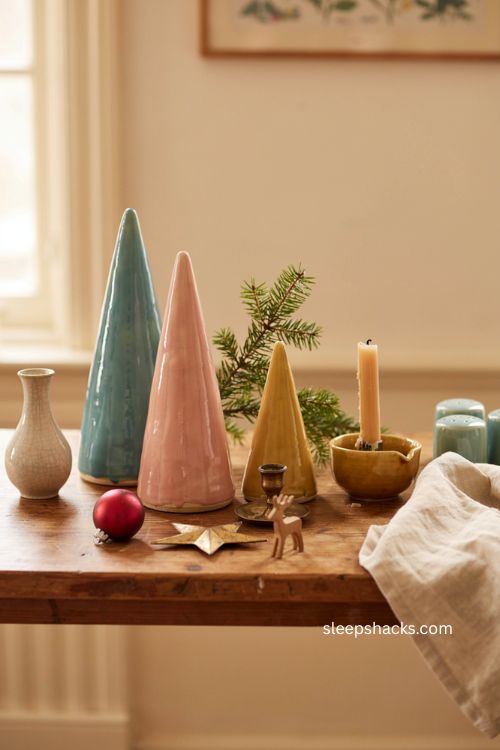 Colorful glazed pottery christmas trees in turquoise pink and mustard yellow retro decor