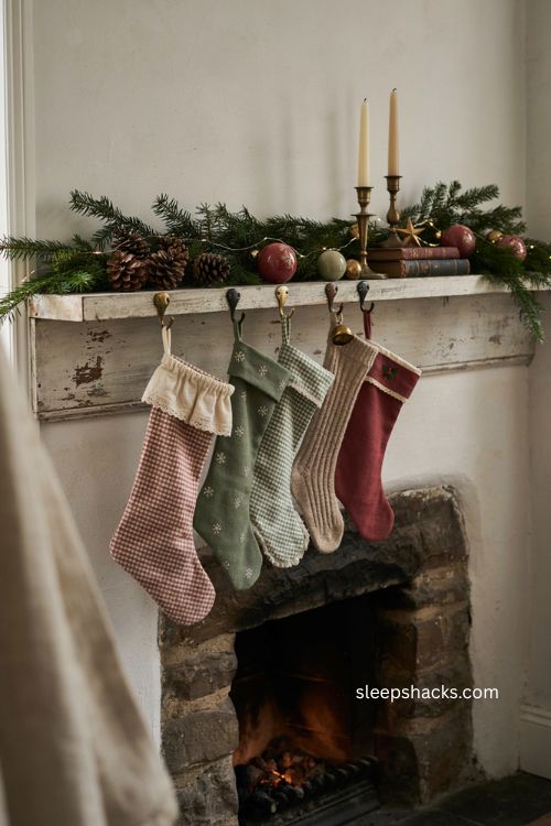 Coordinated gingham Christmas stockings on a cozy decorated mantel 