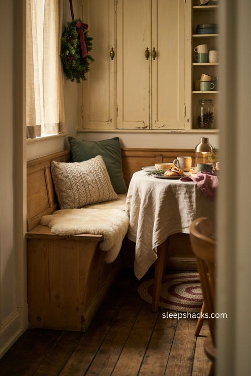 Cozy Christmas kitchen breakfast nook with textured pillows and soft cushions 