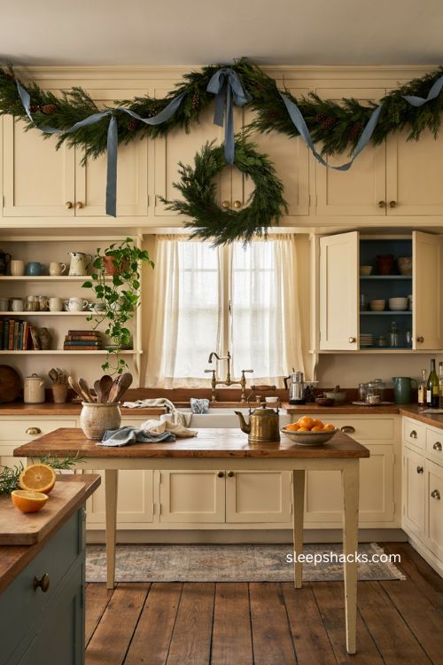 Cozy Christmas kitchen with dusty blue ribbon and evergreen garland