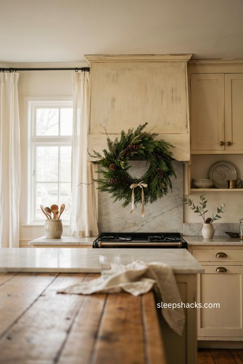 Cozy Christmas kitchen with evergreen wreath on range hood