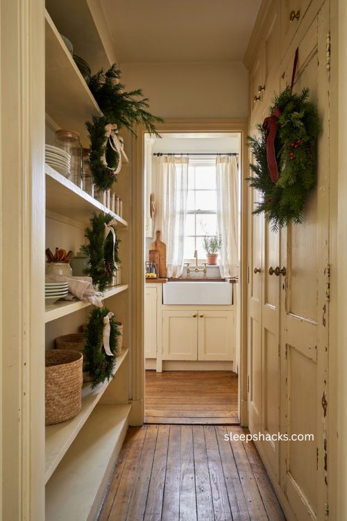 Cozy Christmas pantry with layered wreaths at different heights 