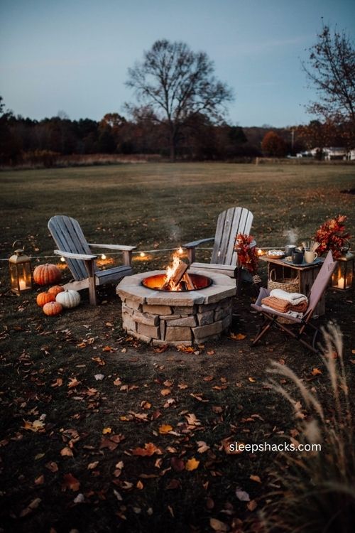 Cozy backyard Halloween fire pit with Adirondack chairs blankets and s'mores setup 