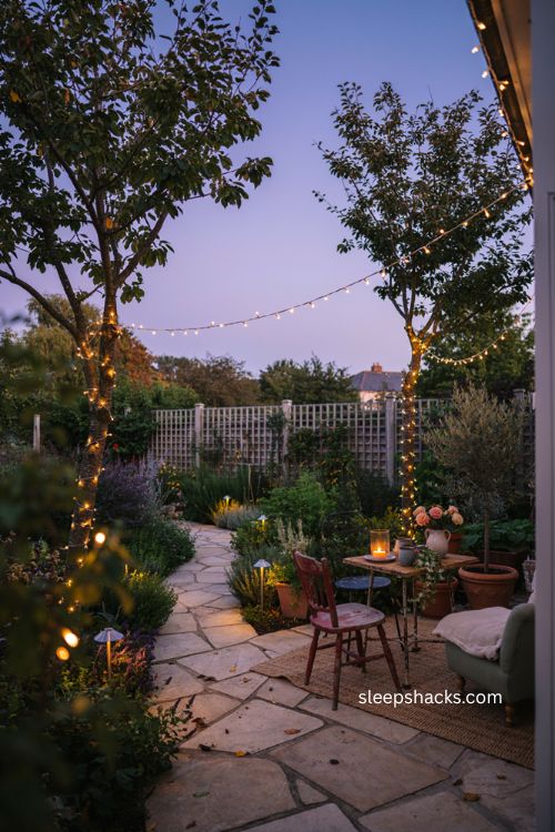 Cozy backyard ideas with warm string lights and garden lanterns 