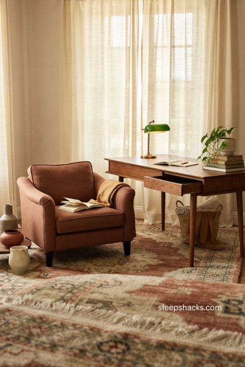 Cozy home office with vintage textured rug warm wood and layered decor 