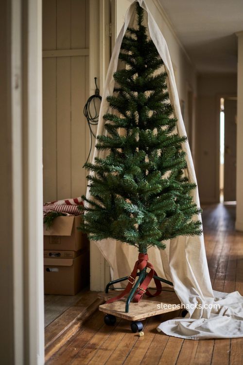 DIY Christmas tree storage on a small dolly with sheet dust cover 