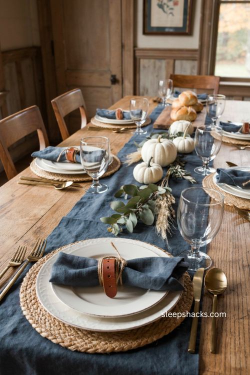 DIY leather napkin rings with blue linen Thanksgiving table decor
