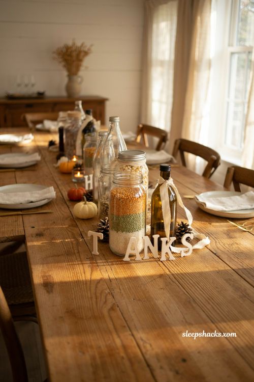 Diy thanksgiving milk bottle grain jar centerpiece with rustic autumn decor
