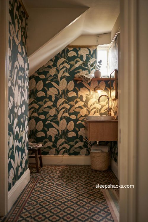 Downstairs toilet ideas with bold wallpaper compact vanity and brass details