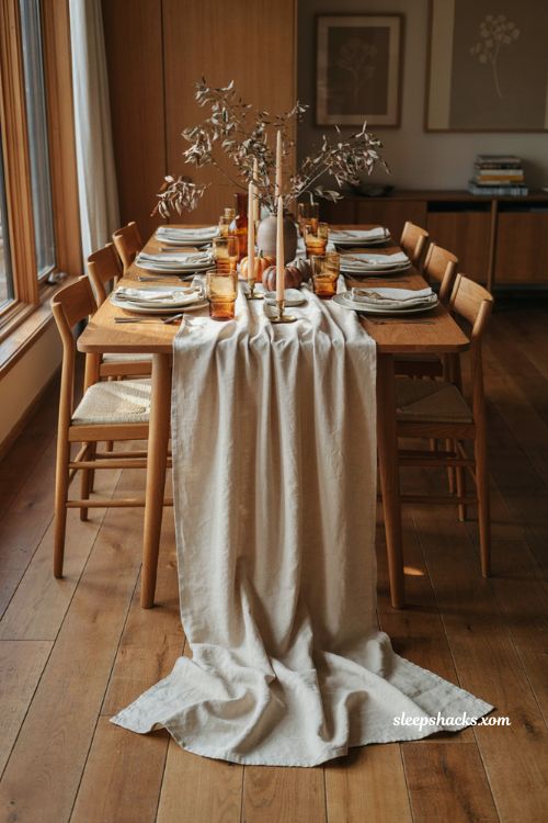 Draped Thanksgiving table runner over the edge for a cozy small gathering

