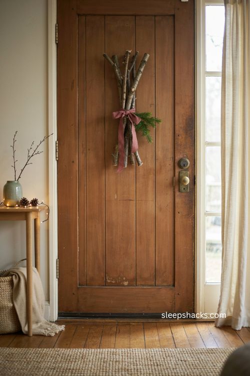 Easy Christmas decor with a natural twig and greenery door hanger 