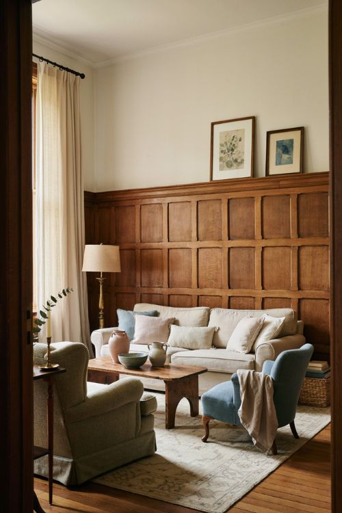 Elegant living room decor with complementary colors layered vintage furniture and soft accents 