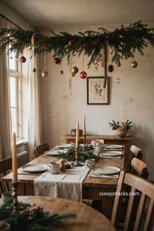 Evergreen branches with hanging Christmas ornaments 
