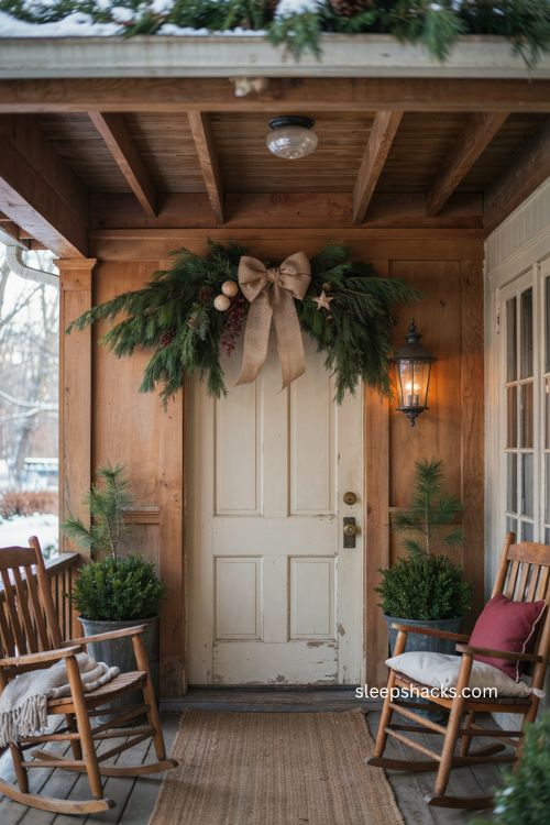 Farmhouse Christmas door swag with burlap bow pine greenery and rustic wood ornaments