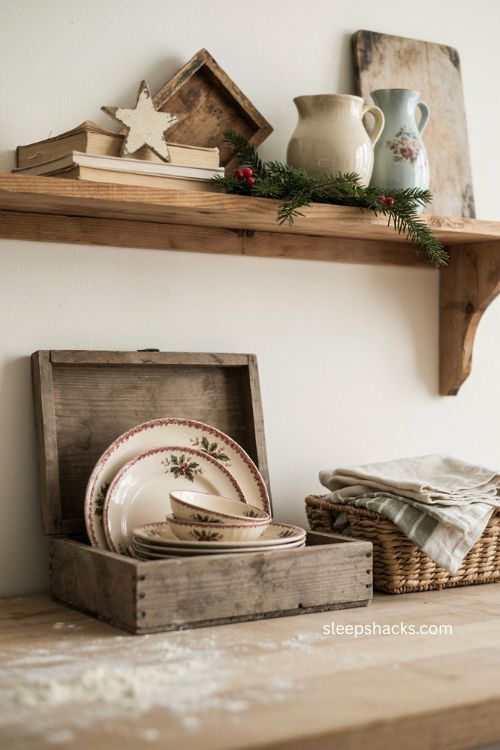 Farmhouse Christmas kitchen with vintage china on an open wooden shelf