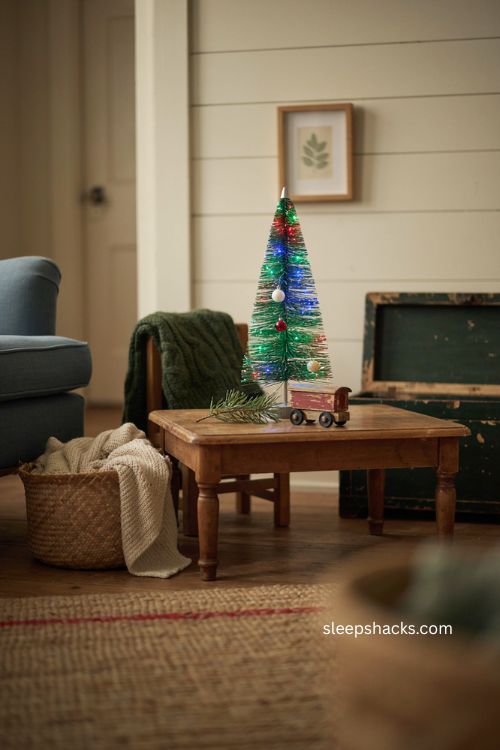 Fiber optic small Christmas tree with colorful lights in playroom