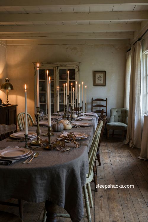 Floating candles over a dining table for cozy indoor Halloween decor 