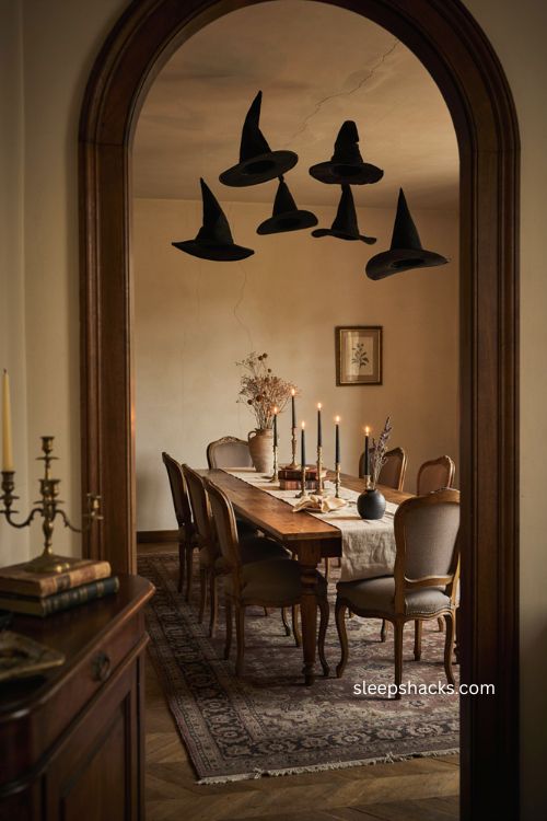 Floating witch hats over dining table for magical Halloween decor