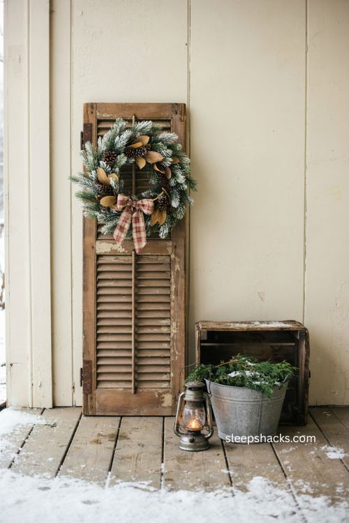 Flocked wreath farmhouse Christmas porch with reclaimed wood