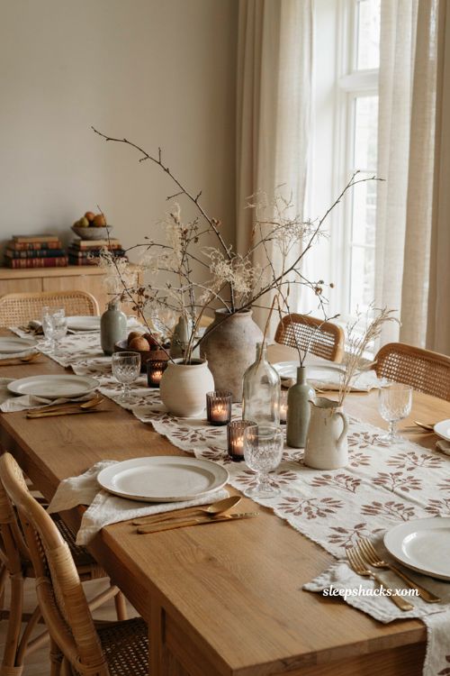Foraged branch Thanksgiving centerpiece with dried grasses varied vases and block printed linens