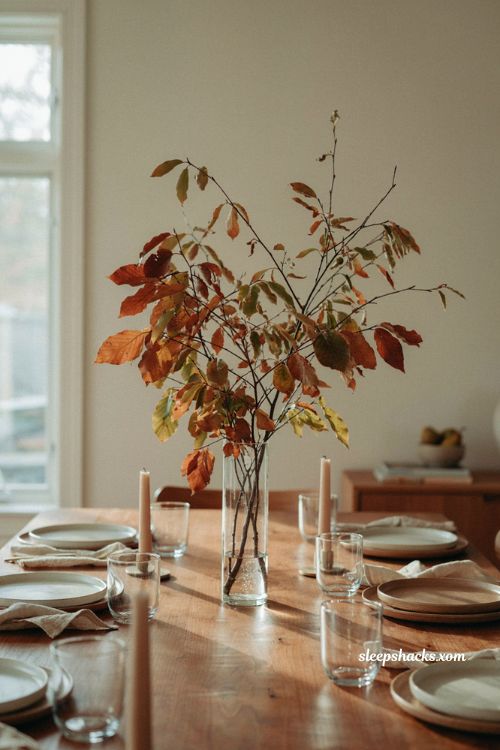 Foraged fall branches in a simple glass vase for Thanksgiving centerpiece 